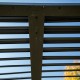 Pergola Bioclimatique aluminium anthracite 10,80 m2 et Toit avec lames ovales Habrita